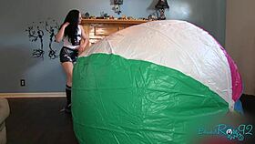 Mega beach ball gets inflated backstage by brunette milf