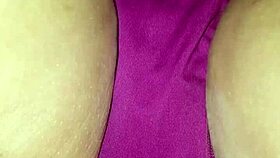 Spreading wet lips wide during erotic panty massage