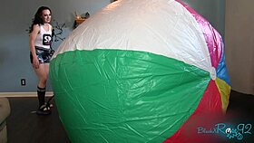 Mega beach ball gets inflated backstage by brunette milf