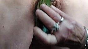 granny rams cucumber deep into her hairy wet beaver