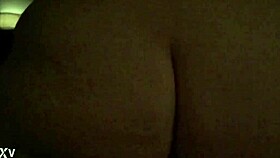 Wife bounces energetically in reverse position during slow motion with glistening skin