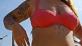 Watch me flash and tease beach hunks while filming hot video