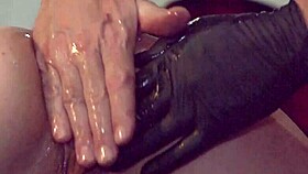 Slut's pussy stretched wide by gloved fist
