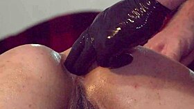 Slut's pussy stretched wide by gloved fist