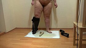 see this plump mistress pee dirty on rubber dick in heels