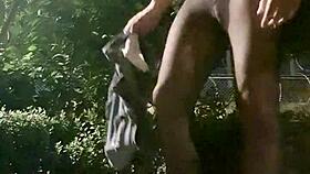 Ladyboy masturbates and cums during outdoor exposure