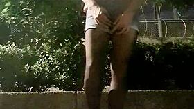 Ladyboy masturbates and cums during outdoor exposure