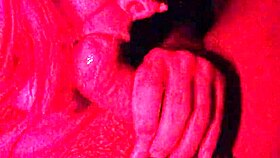 masked in the red light sucking cock