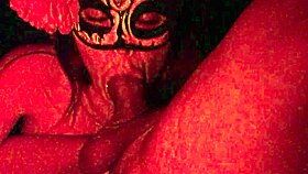 masked in the red light sucking cock