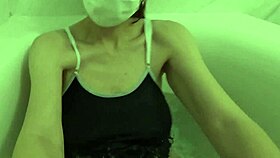 asian wife in swimsuit masturbates then pees after