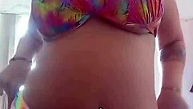 pamela shows off her body while dressing