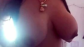 pamela shows off her body while dressing