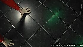 Masked lady Christina indulges in intense latex bondage play