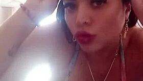 pamela shows off her body while dressing