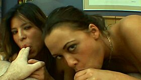 two girls share oral together