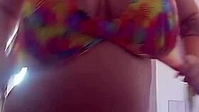 pamela shows off her body while dressing