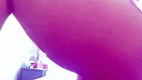 pamela shows off her body while dressing