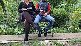 Curvy milf jerks off huge cock in park while reading