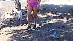 vivian fernandes walks down the street in shorts