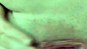 A babe with glasses masturbates her pussy with fingers