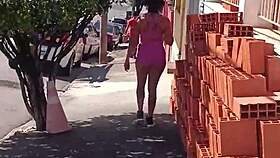 vivian fernandes walks down the street in shorts