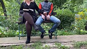 Curvy milf jerks off huge cock in park while reading