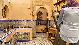 arab husband and asian wife in kitchen