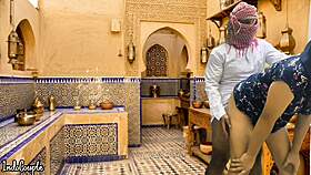 arab husband and asian wife in kitchen