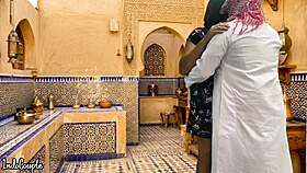 arab husband and asian wife in kitchen