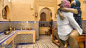 arab husband and asian wife in kitchen