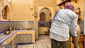 arab husband and asian wife in kitchen