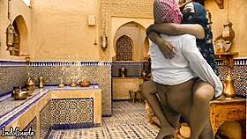 arab husband and asian wife in kitchen
