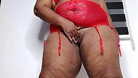 Ebony milf teases in red lingerie
