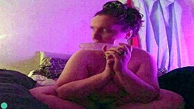 dildo fellatio on the bed
